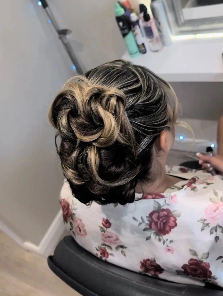 A sculpted blonde bridal hairstyle by Becky