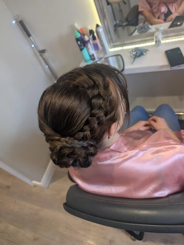 Braided detail in a hairstyle by Becky