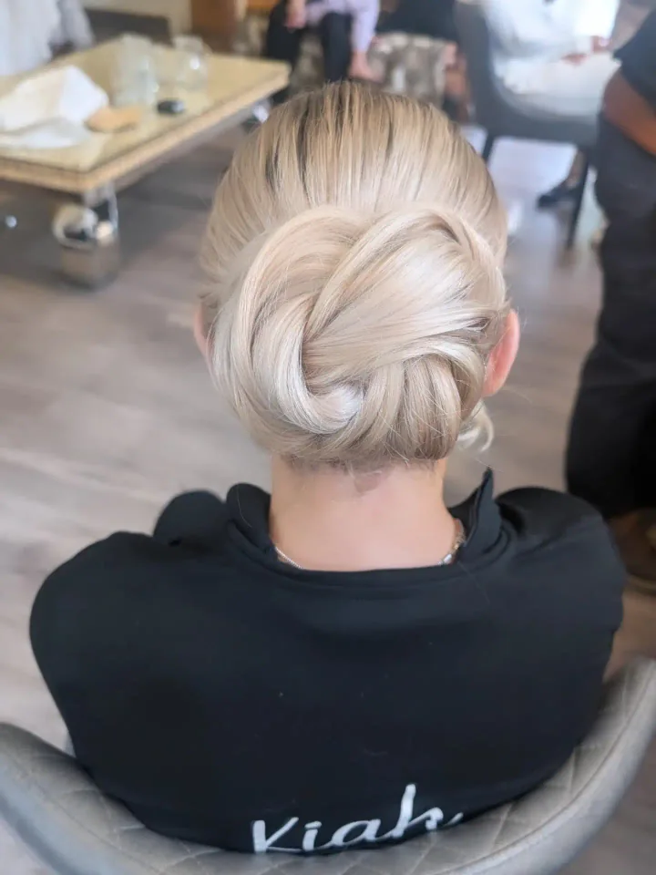 Kelly’s sculpted low bridal updo, created by Hair Up Solutions