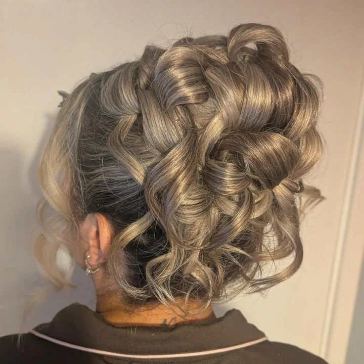 A sculpted occasion hairstyle created by Becky.